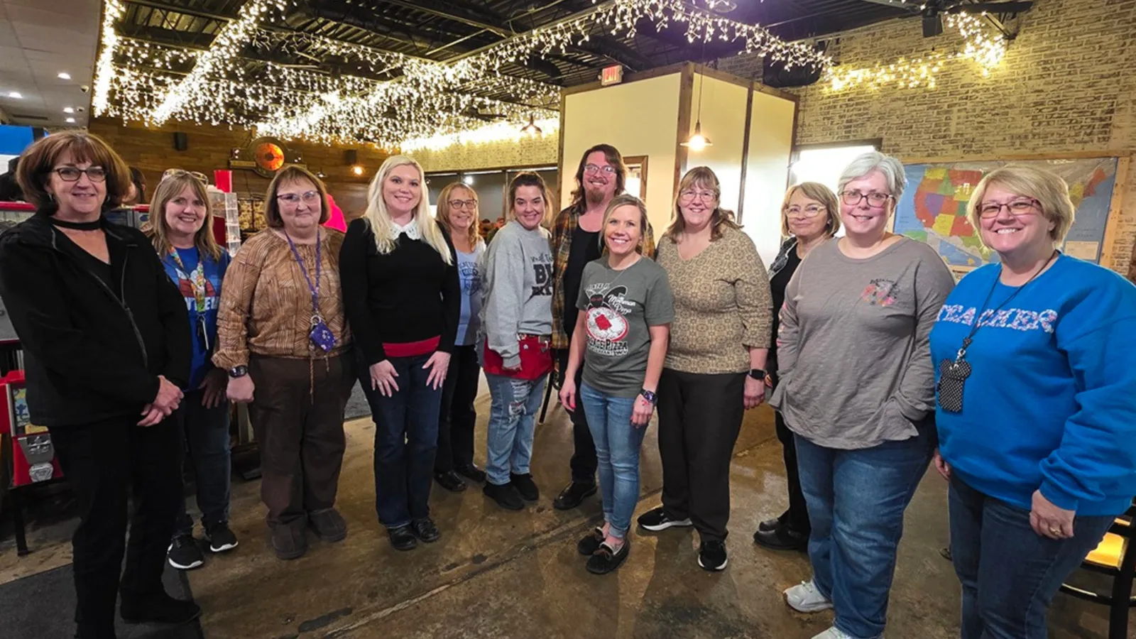 Members pose for a picture at an appreciation event