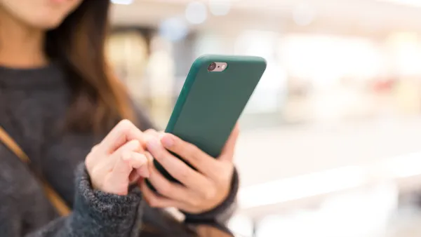 A person looking at their cell phone