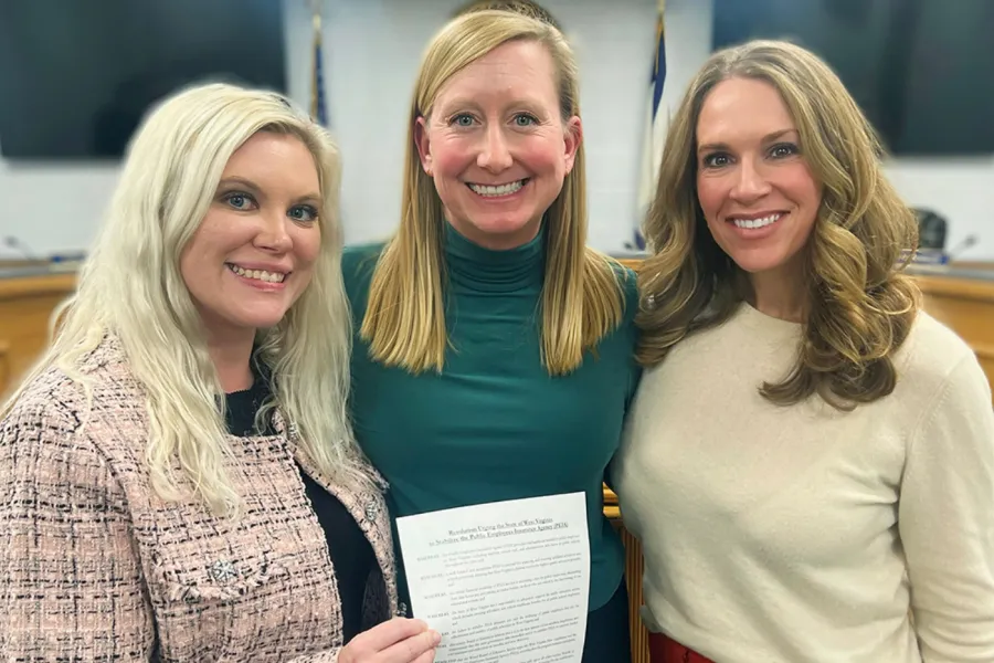 Wood County members with a signed PEIA resolution